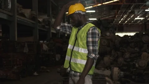 Factory african american worker looking at camera and cross his arms. Video stock 143956772