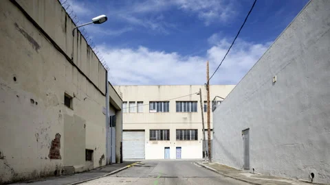 Factory and industrial complex with passing clouds and VR woman Video stock 316626138