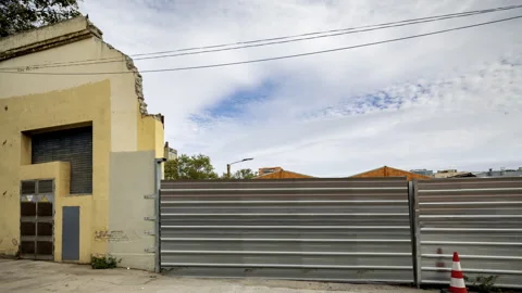 Factory and industrial complex with passing clouds Stock Footage 316706948