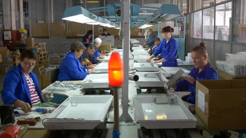 Factory assembly line assembly of electric heaters by hand. Video stock 277339499
