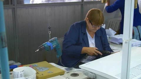 Factory assembly line assembly of electric heaters by hand. Stock Footage 277339777