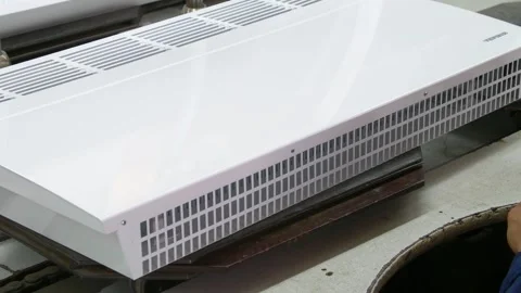 Factory assembly line assembly of electric heaters by hand. Video stock 277339991