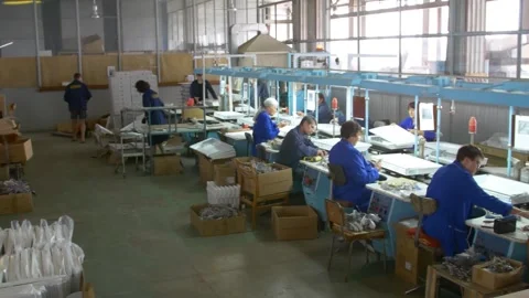 Factory assembly line assembly of electric heaters by hand. Stock Footage 277340078
