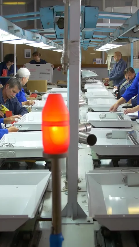 Factory assembly line assembly of electric heaters by hand. Vertical video. Stock Footage 277382638