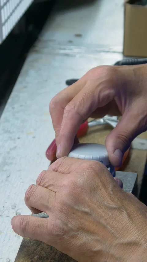 Factory assembly line assembly of electric heaters by hand. Vertical video. Video stock 277382676