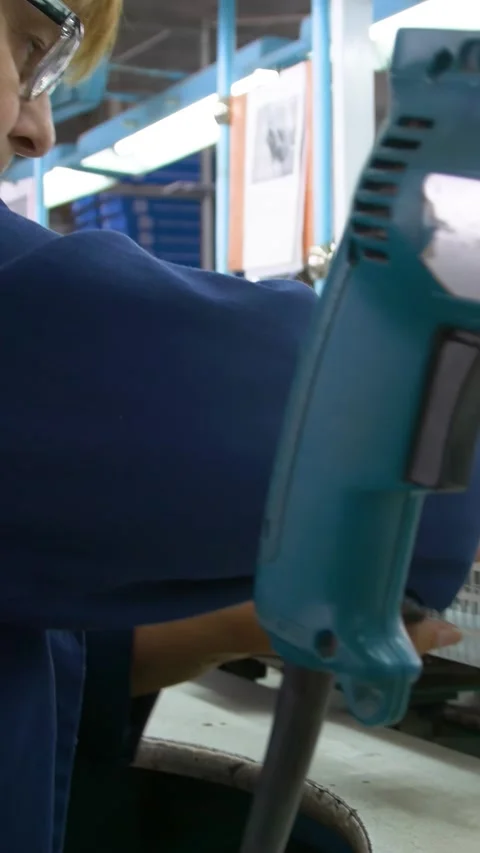 Factory assembly line assembly of electric heaters by hand. Vertical video. Stock Footage 277382779