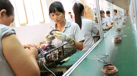 Factory assembly worker checking  product for reliability, China Stock Footage 33527427
