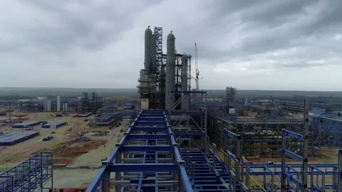 A factory with blue sky in the background Stock Footage 138225576