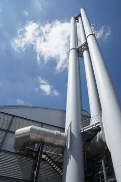 Factory building with chimney stack or smokestack Stock Photos