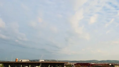 Factory building Pipe n white smoke at Vienna city on blue sky white cloud Stockbeeldmateriaal 330293480