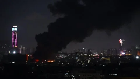 A factory catched a fire with lots dark smoke at night horizontal composition Stock Footage 254633512