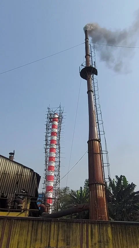 A factory chimney emitting smoke and po... | Stock Video | Pond5