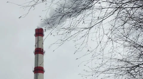 Factory chimney smokes on a background of gray sky Stock Footage 61260475
