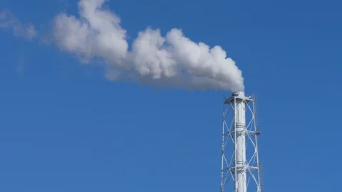 Factory chimney spouting volumes of dense smoke into the sky Stock Footage 124184258