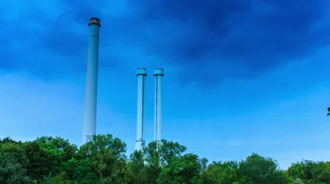 Factory chimney  under blue sky - timelapse Stock Footage 54941936