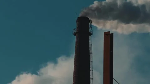 Factory chimneys emit polluting smoke into the atmosphere 스톡 동영상 281942132