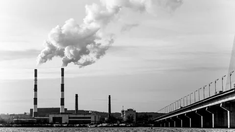 Factory with chimneys, out of which comes a lot of smoke. Time Lapse Stock Footage 72164090