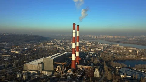 Factory in the city, top view two pipes from which smoke comes. Vídeo Stock 126791857