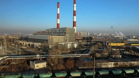 Factory in the city, top view two pipes from which smoke comes. Видео 126792018