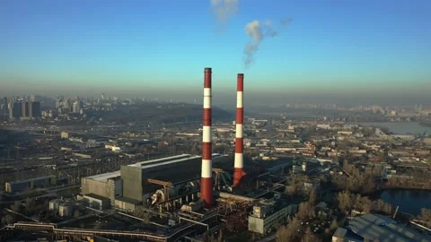 Factory in the city, top view two pipes from which smoke comes. Stock Footage 131347221