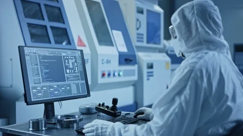 Factory Cleanroom: Engineer, Scientist Talk and Use Tablet Computer in Workshop Stock Footage 126152056