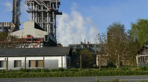 Factory Complex With Car Passing by Stock Footage 50489121