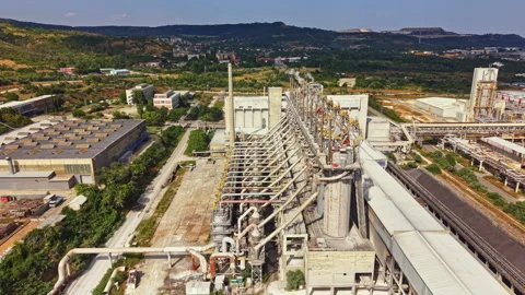 Factory complex located in a rural area with various structures and equipment Stock Footage 341382597