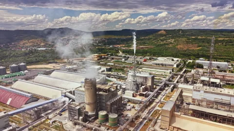 Factory complex shows production facilities and industrial activity in the Video stock 340883901