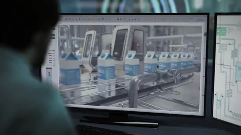 Factory computer operating the automated machinery on the conveyor line Stock Footage 292823670