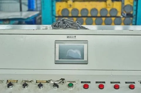 Factory control panel with red buttons and display Stock Photos