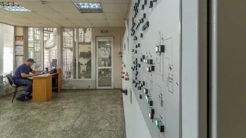 Factory Control Panel timelapse hyperlapse. Engineer standing in front of the Stock Footage 84395034