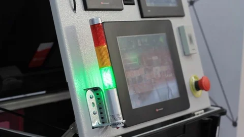 Factory control panel with various buttons and lights, control computer. Video stock 121888528