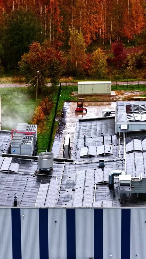 Factory Cooling Towers and Solar Panels In Autumn - Vertical Aerial View Stock Footage 339039911