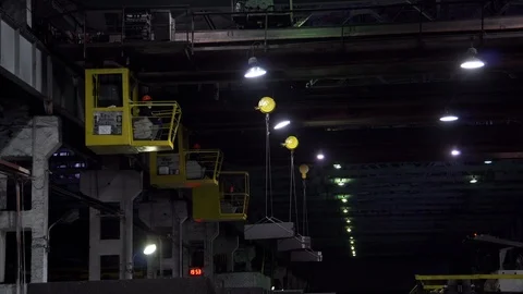 Factory cranes in workshop transport graphite bars, movement steel, people work Stock Footage 115926208