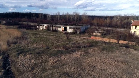 Factory - dilapidated, rusted. Camera flies parallel. Camera slowly closing in. Stock-Footage 104128952