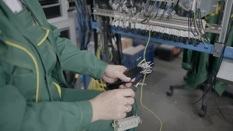 Factory electrician engineer installing cables with screwdriver, tighten the nut 스톡 동영상 117364304