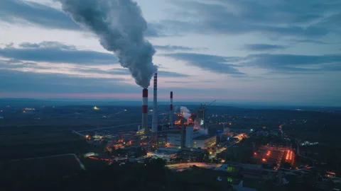 Factory emissions from smokestacks Stockbeeldmateriaal 212572511