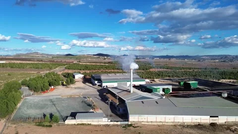 Factory emites smoke pollution contamination in Spain Stock Footage 265944615