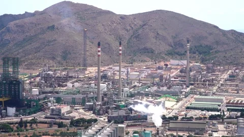 Factory emits smoke pollution power station in Cartagena Stockbeeldmateriaal 242084600