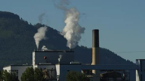 Factory emitting smoke Stock Photos