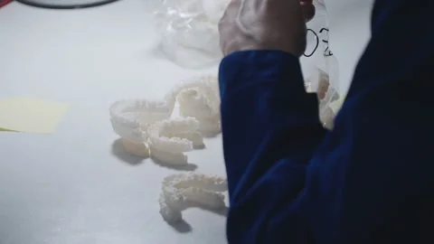 A factory employee marks teeth on a 3D printer 스톡 동영상 167738569