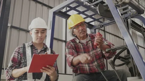 Factory engineer and staff checking goods on shelves in warehouse. Stock Footage 159535461