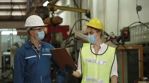 Factory engineer check machine equipment. Safety hard hat to prevent accidents. Stock Footage 131695652