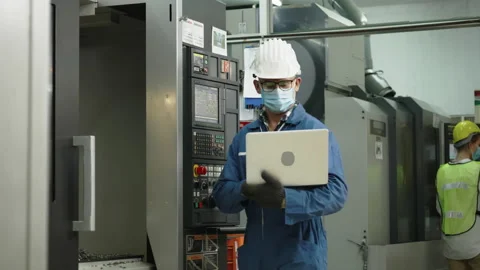 Factory engineer check machine equipment. Safety hard hat to prevent accidents. Stock Footage 131695714