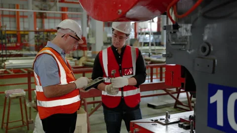 Factory engineer is checking the operation of the machines Stock Footage 214450268