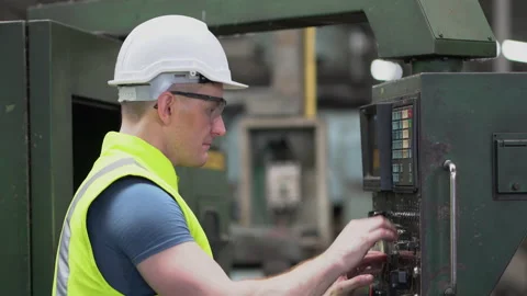 Factory Engineer inspecting and controlling machinery and talking with team Stock Footage 139096788