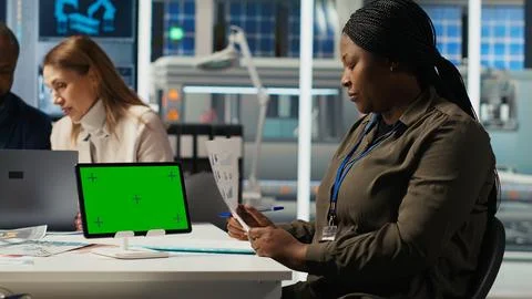 Factory engineer tripping, refining production using green screen tablet Stock Photos