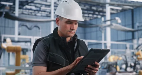 Factory Engineer Using Digital Tablet for Maintenance and Diagnostics Stock Footage 344391954
