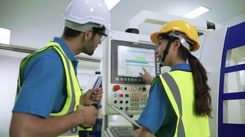 Factory engineers patrolling the workers who control the machine control panel Stock-Footage 154876020