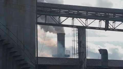 Factory expelling pollution and smoke through a chimney. Environmental problem Stock Footage 234830968